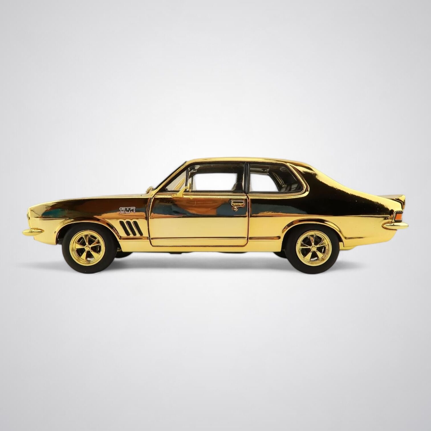 1:24 scale Holden LJ Torana 50th Anniversary Twin Set – green GTR and gold XU‑1 models with opening bonnet, doors and boot