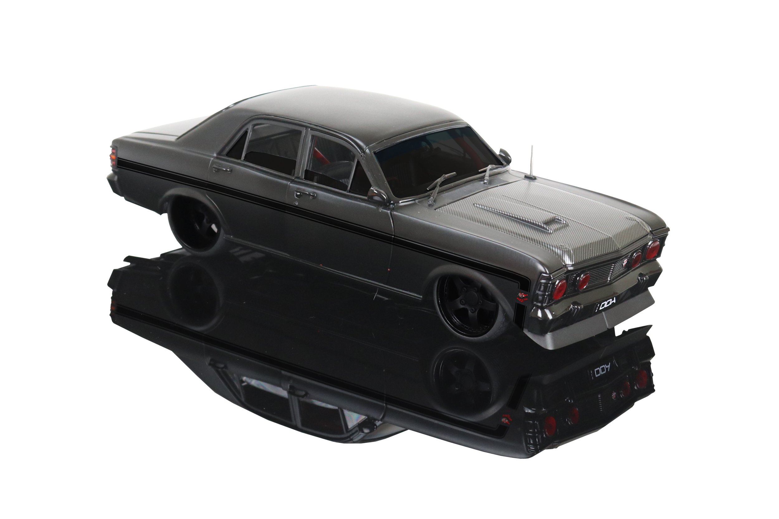 Limited-edition 1:24 scale DDA Ford Falcon XW 1969 “Inferno” die-cast model – matte black, carbon-look bonnet, red headlights, window-box packaging.