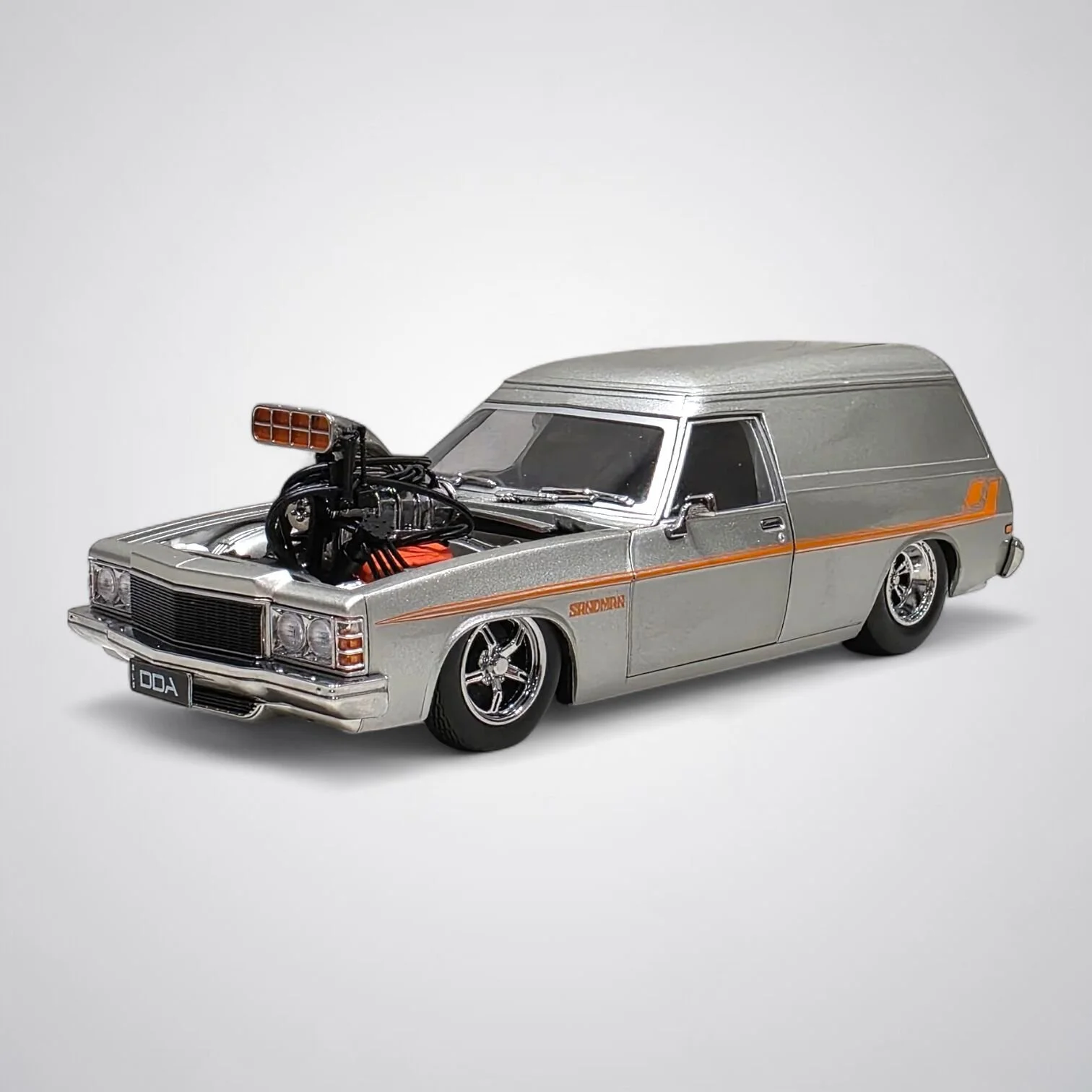 1:24 Holden HZ Panel Van Supercharged die-cast model car by DDA Collectibles in silver with detailed interior, engine, and opening parts