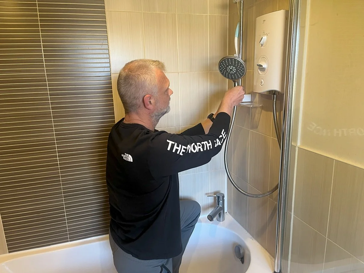 Frank the handyman is installing a new shower hose