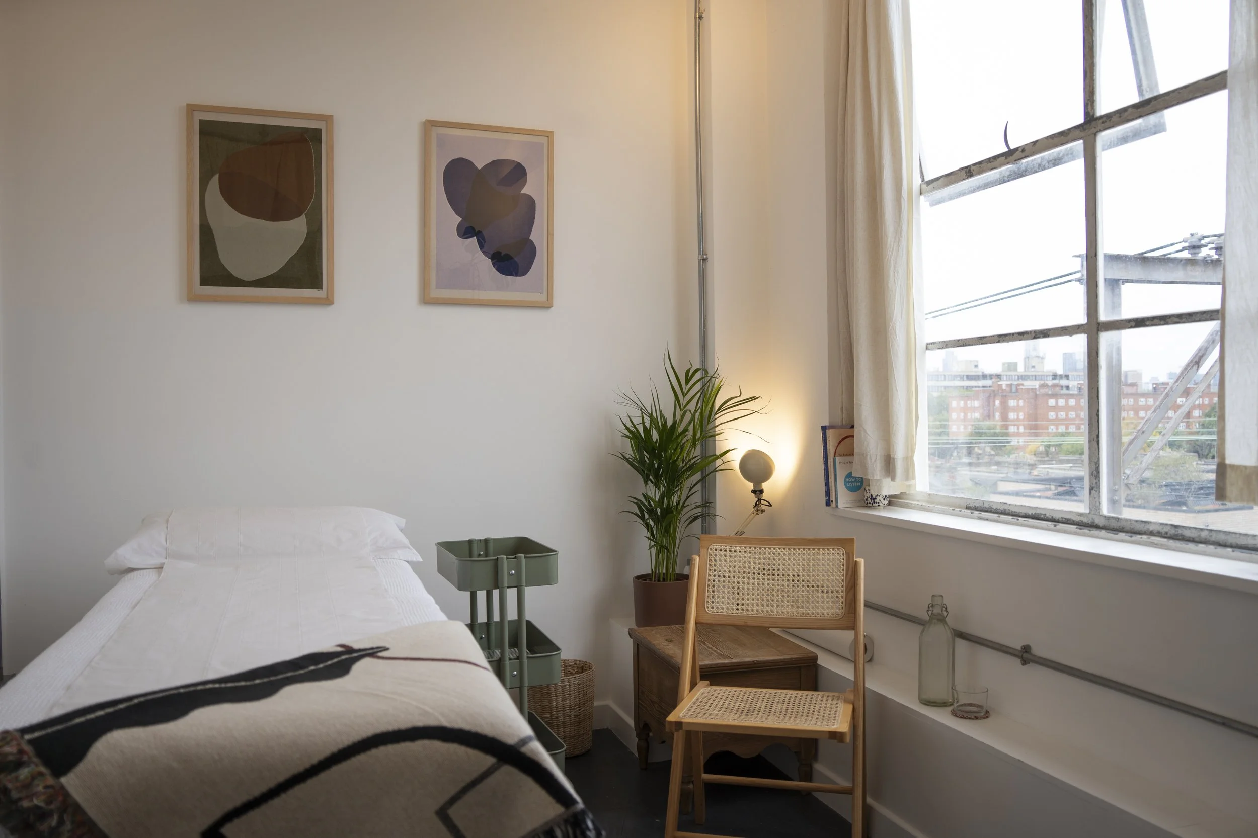 The calm treatment room at Emily Greenland-Wright’s Hackney clinic in Netil House, overlooking London Fields. A quiet sanctuary for Five Element Acupuncture.