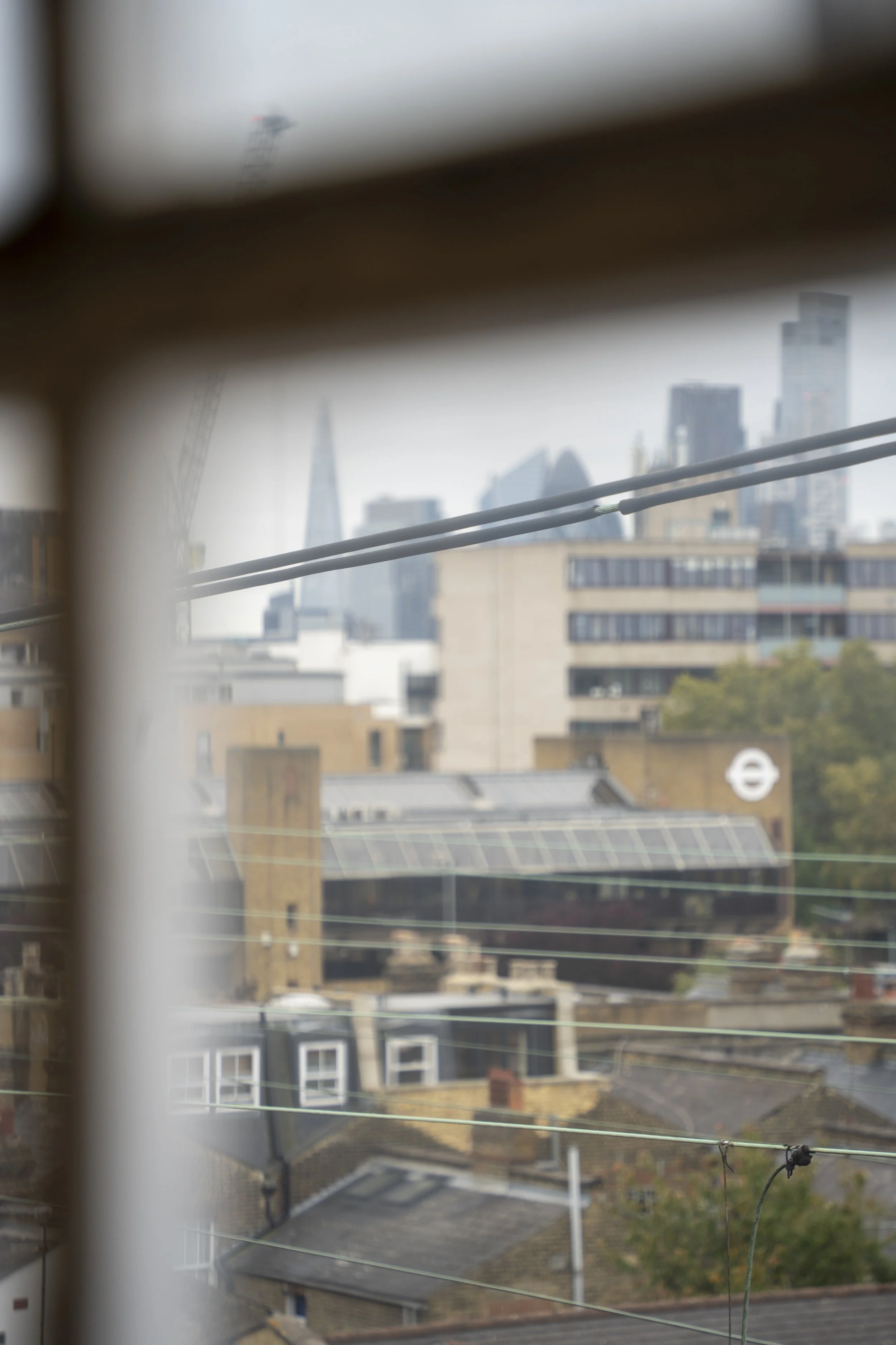 View of the London skyline from the window of Emily's acupuncture clinic, overlooking the city's rooftops.