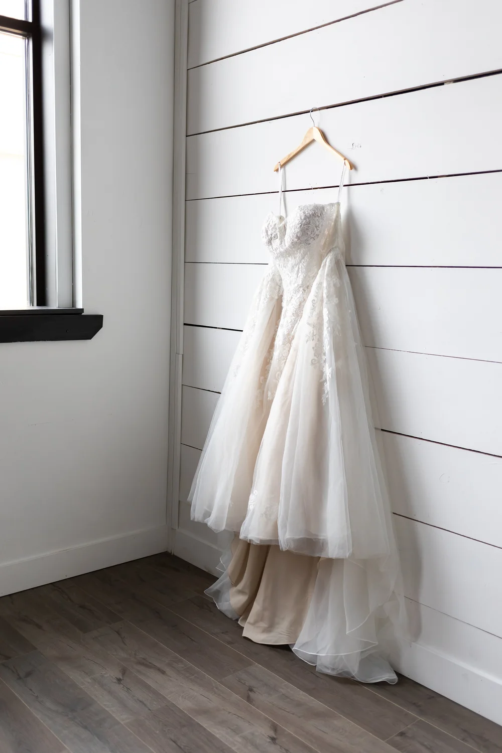 The naturally lit Photo Nook studio with white pine board walls