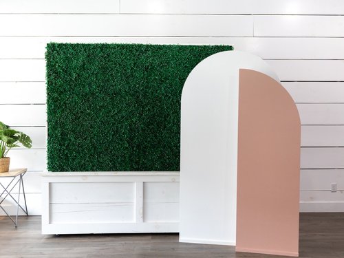 The arch backdrop set with the greenery wall