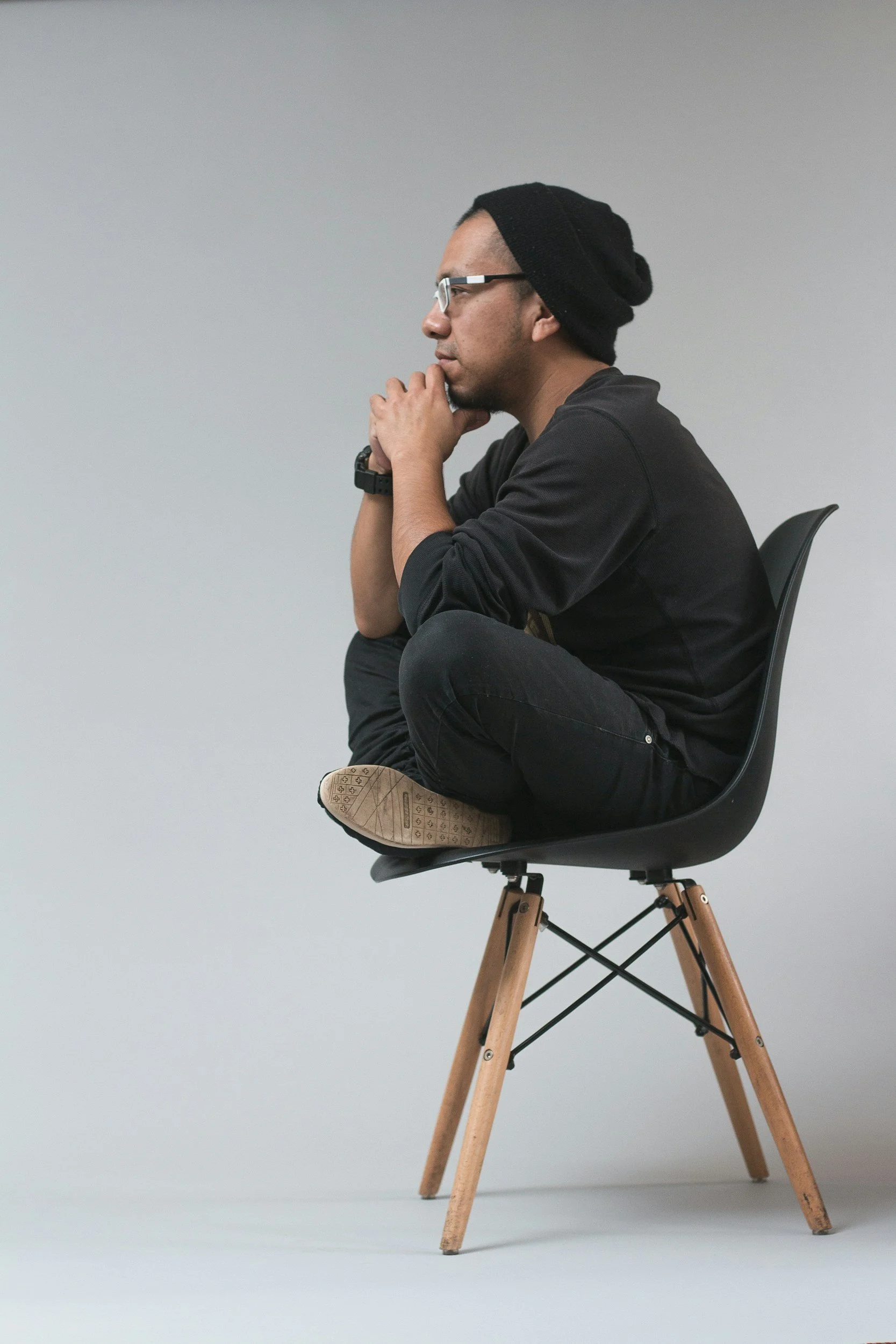 Person sitting on a chair thinking