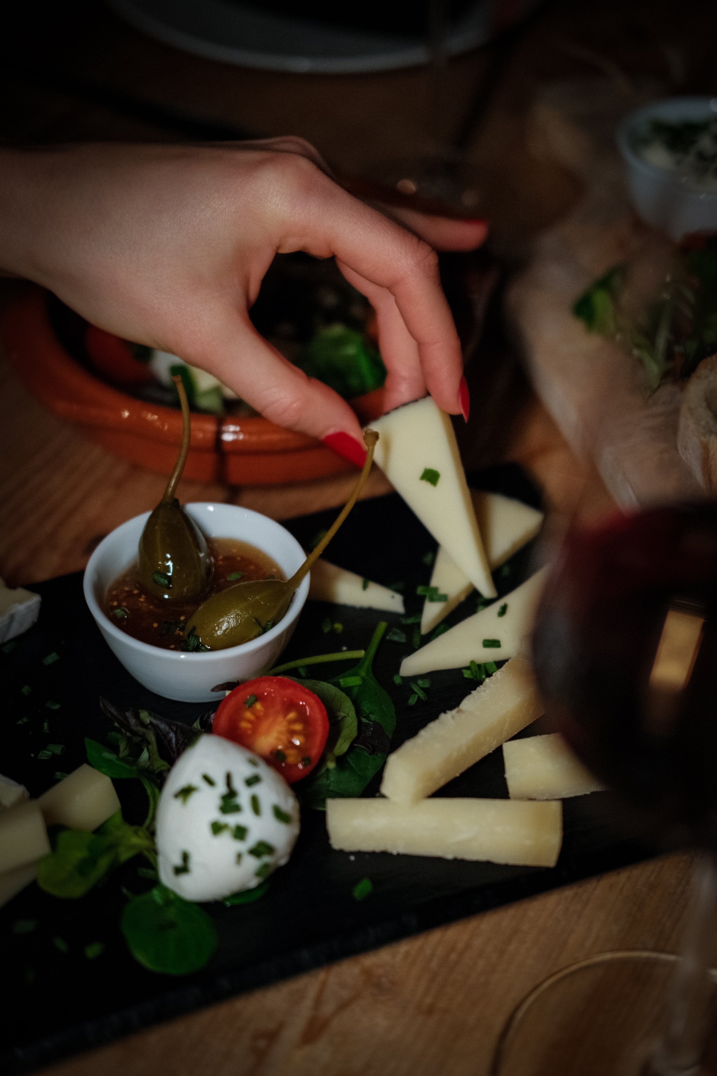 Overhead shot of wine glasses and small plates in a wine tasting photoshoot