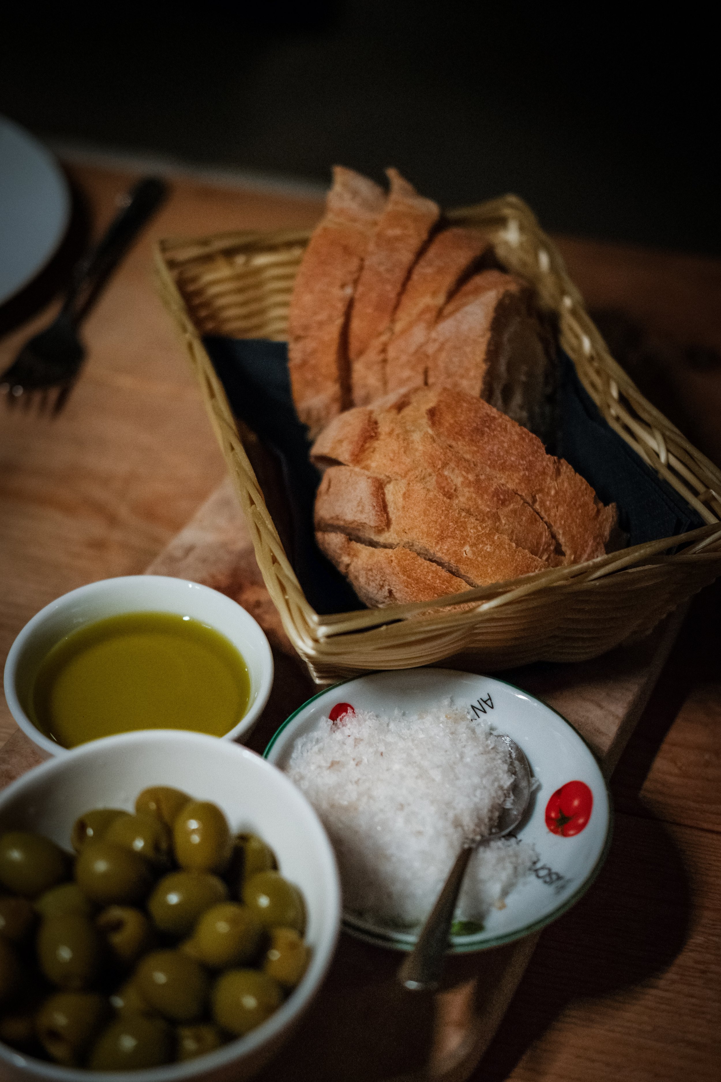 Close-up shot of olives, nuts, and crackers styled for food photography at Raphaels Wine Bar