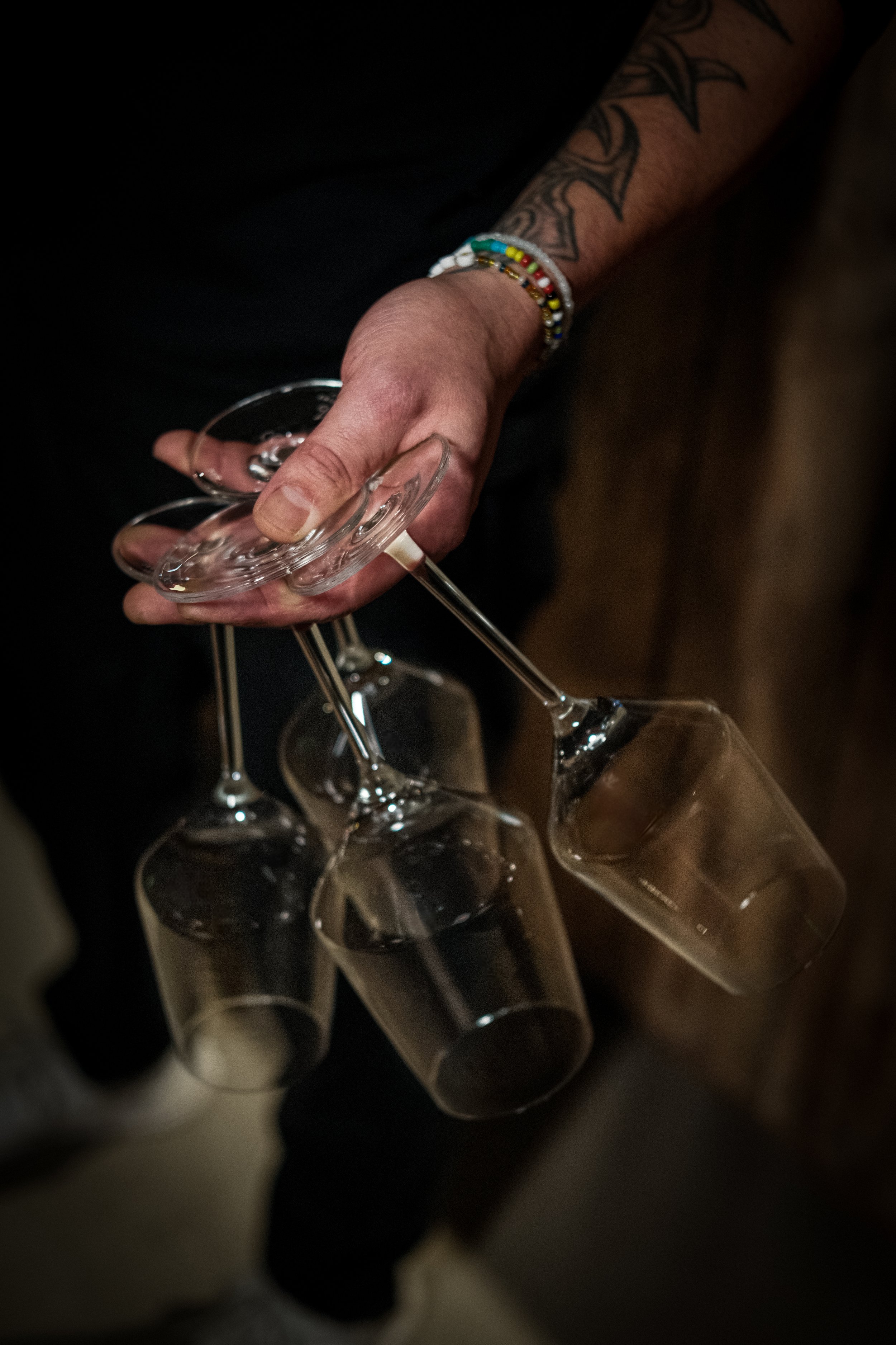 Close-up of a charcuterie platter and wine glass, highlighting food and wine bar photography
