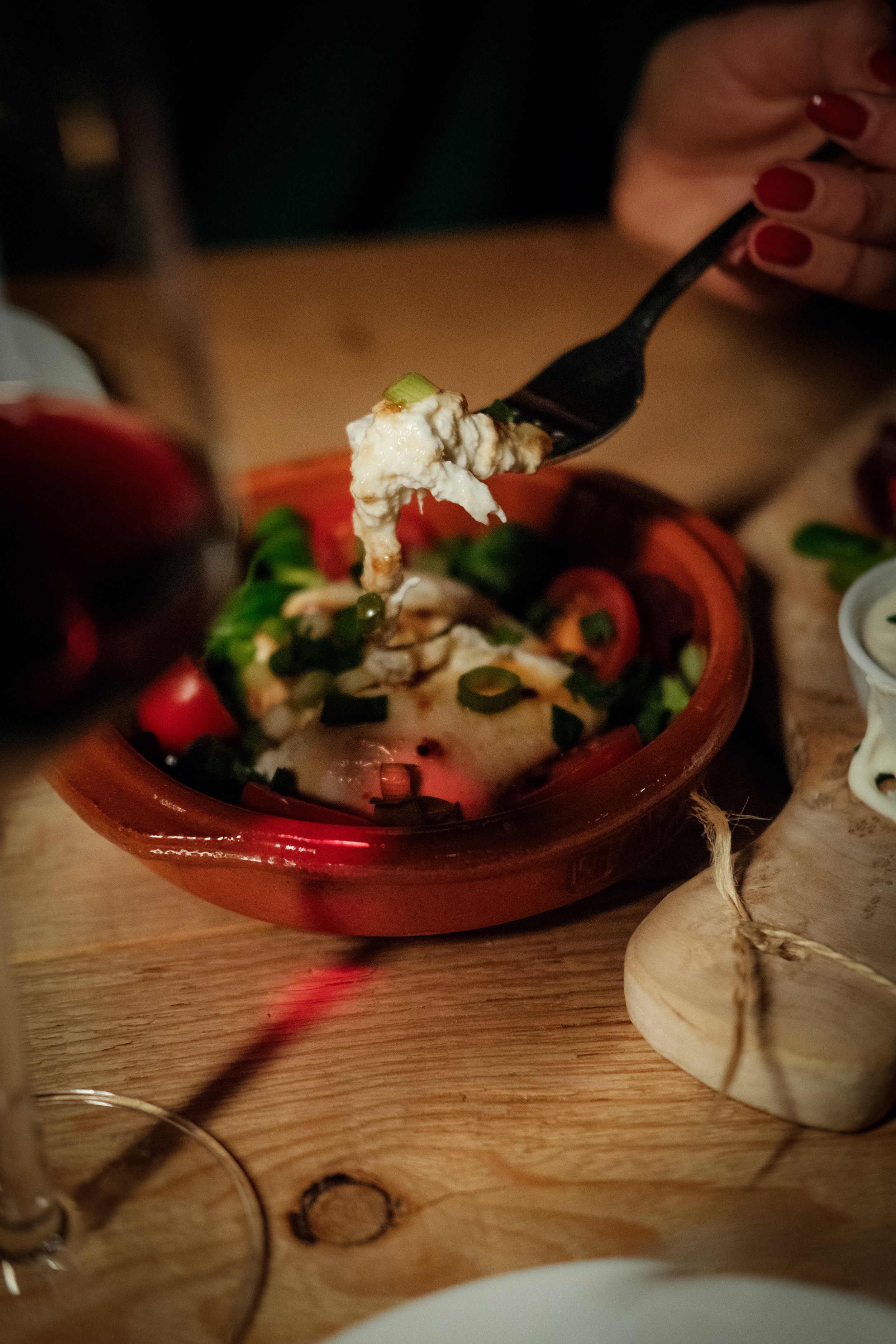 Appetizers and tapas beautifully arranged on rustic plates, captured during the wine bar photoshoot