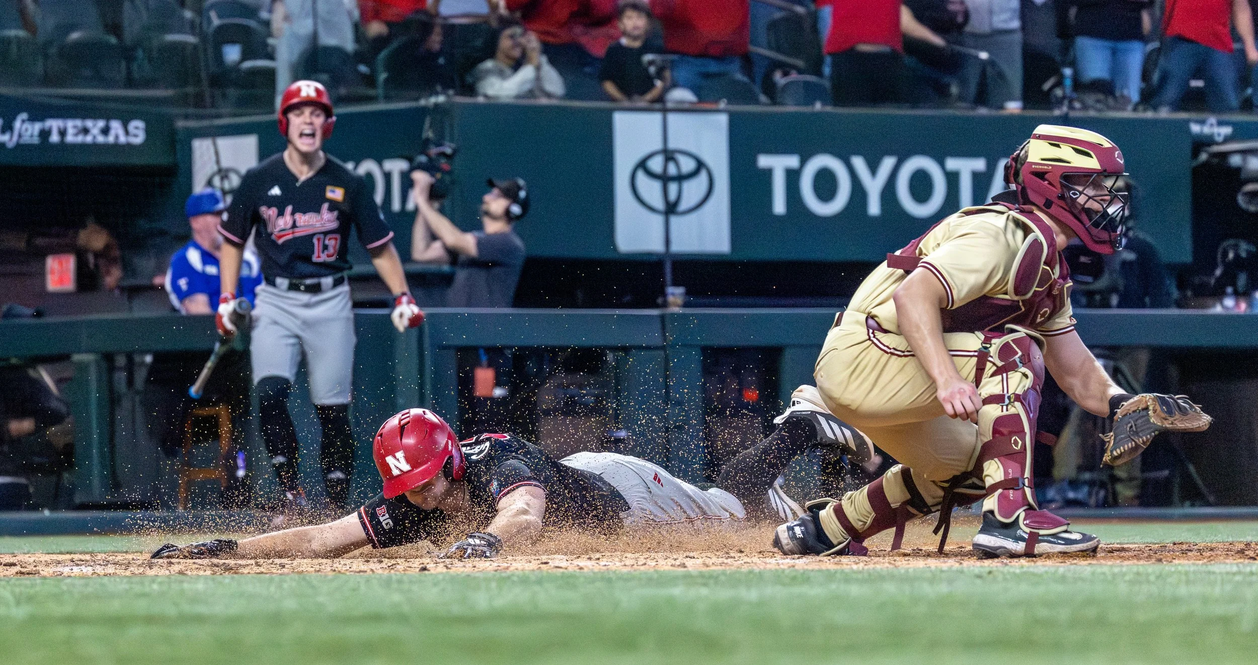Dylan Carey (Nebraska Huskers Baseball) sliding into home 