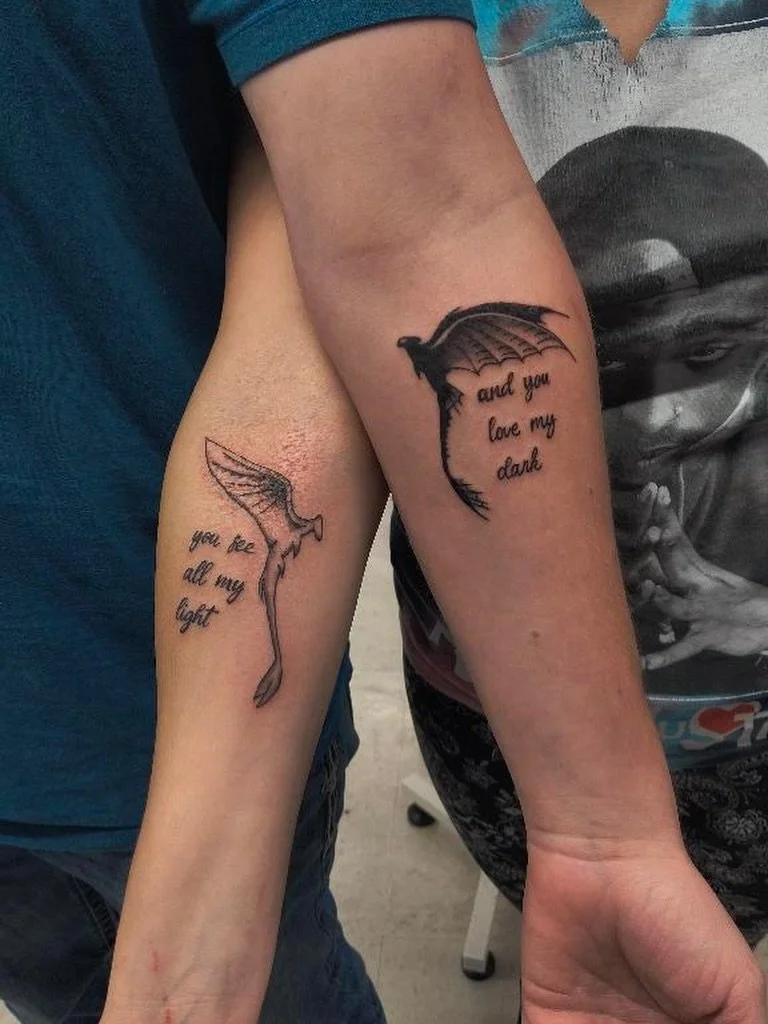 matching-dragon-wings-couples-tattoo-light-dark-script.jpg