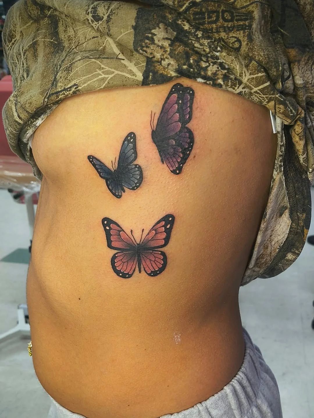 colorful-monarch-butterflies-trio-rib-side-tattoo.jpg
