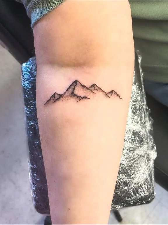 minimalist-mountain-range-forearm-tattoo.jpg