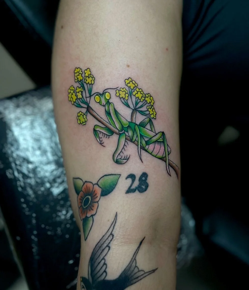Full color praying mantis with flowers tattoo