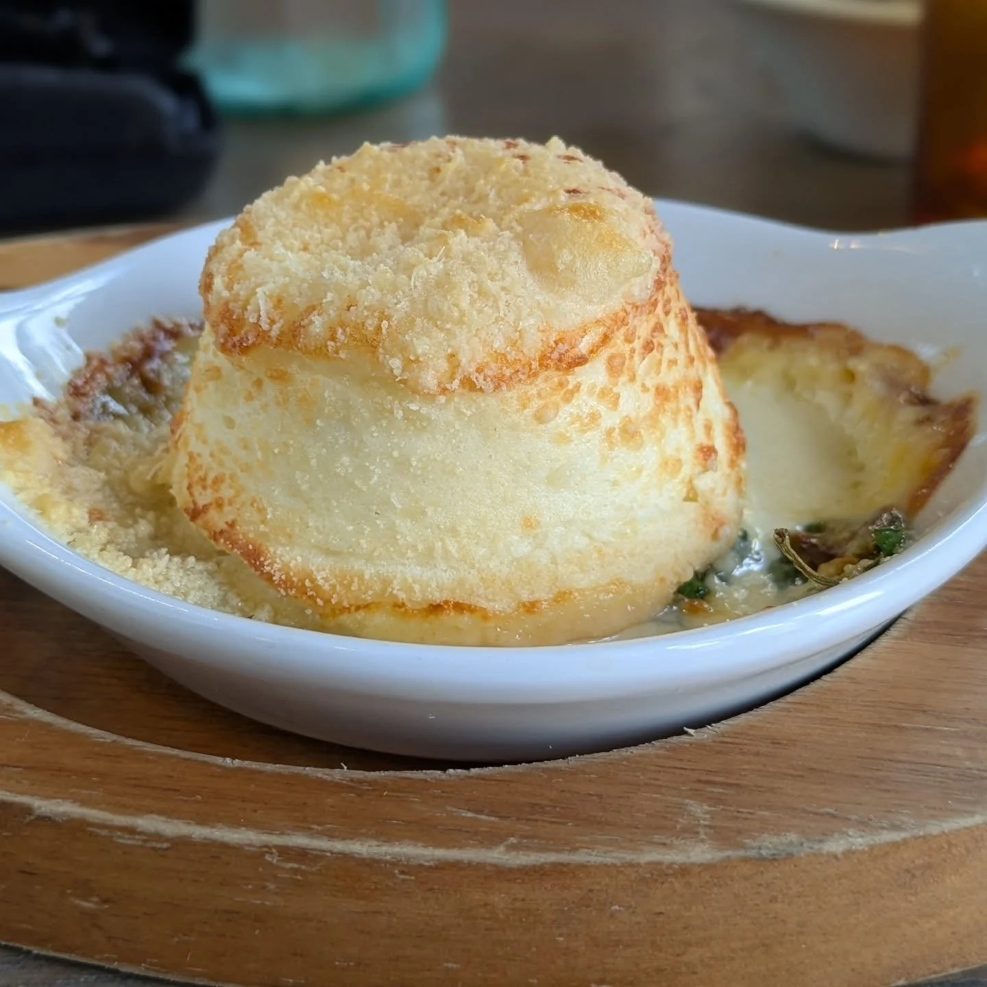 COVID has been and kicked my butt this week. Like a bad dose of flu, I have been in bed for much of the time since Tuesday. 

So here's a lovely little Lancashire cheese souffle I had last month to cheer me, and my taste buds, up because frankly, not
