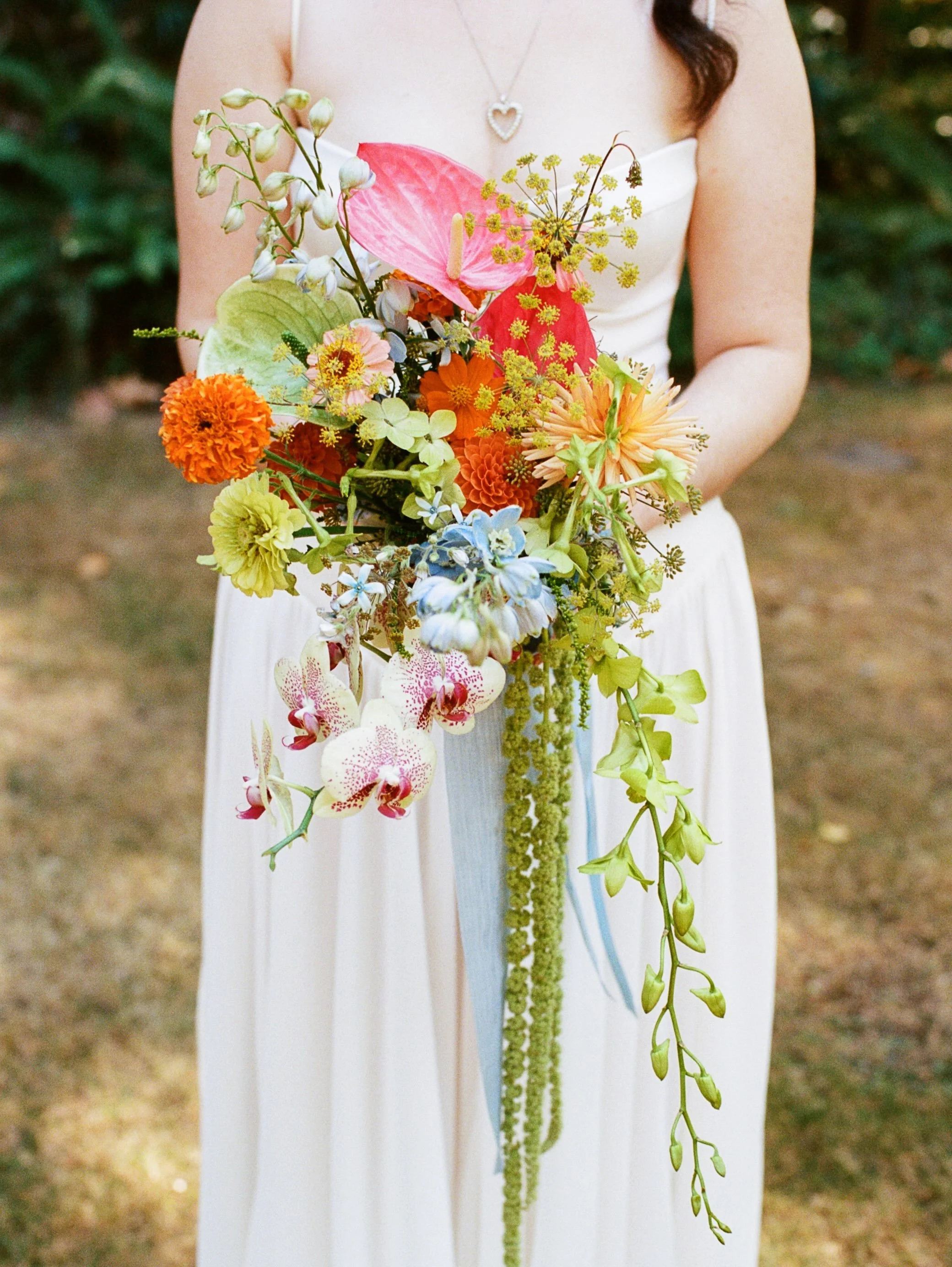 L + S on film on the most magical day. 🩵💚🧡
&bull;
&bull;
Coordination: @yourperfectbridesmaid 
Venue :  @skamanialodge 
Catering :  @skamanialodge
Floral :  @jackelopefloralco 
Photography :  @kalliedawnphotography 
DJ :  @_adam.bkr
Belly Dancer :