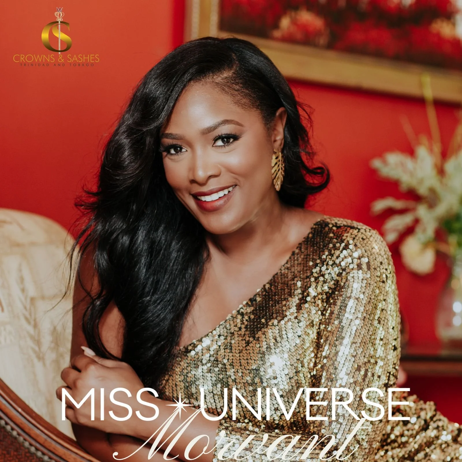 A smiling woman with long black hair wearing a gold sequined dress, gold earrings, and light makeup, sitting in a warmly decorated room with red walls, floral artwork, and flowers in the background. Text on the image reads "Miss Universe Moutan" and a logo for "Crowns & Sashes" in Trinidad and Tobago.