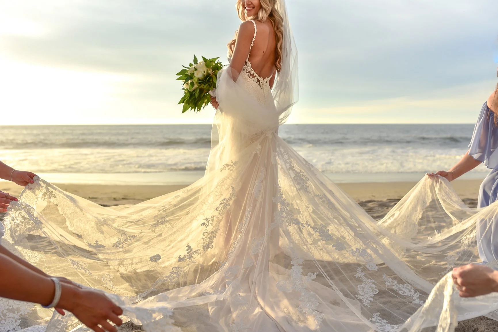 Bride and bridesmaids portrait at the beach of the Hyatt Ziva Resort in Puerto Vallarta, Mexico.