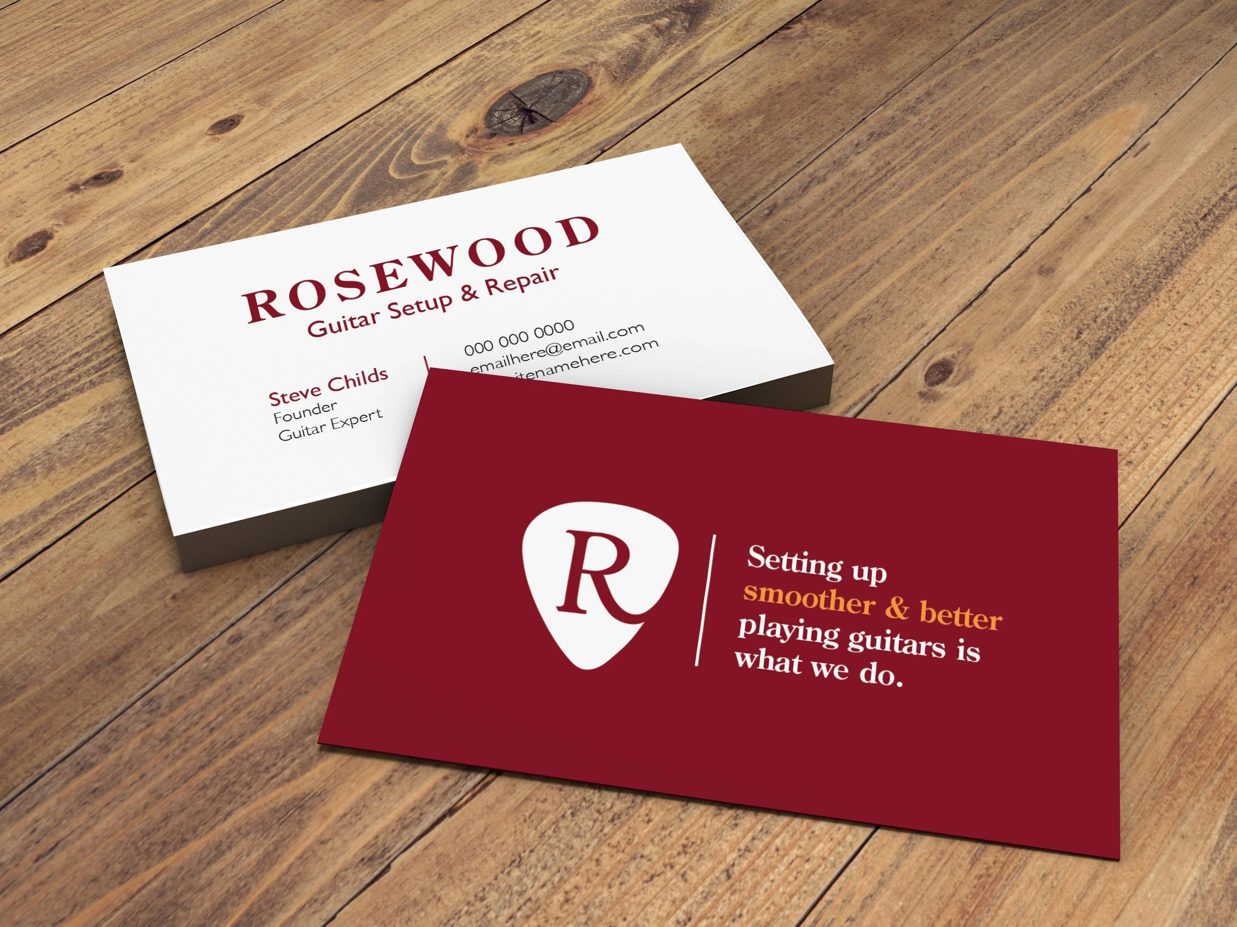 Two business cards on a wooden surface. The top card is white with red and black text for a guitar setup and repair service. The bottom card is red with white and yellow text for a music shop or similar business.