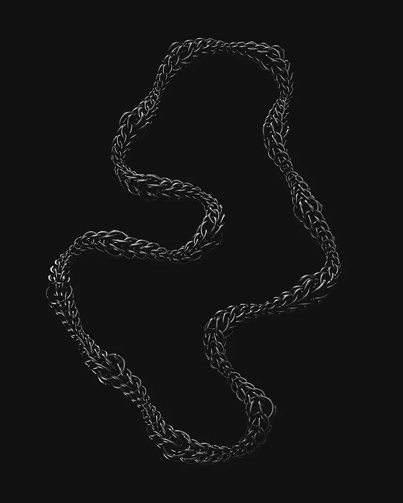 A silver chain mail necklace arranged in an organic shape against a black background.