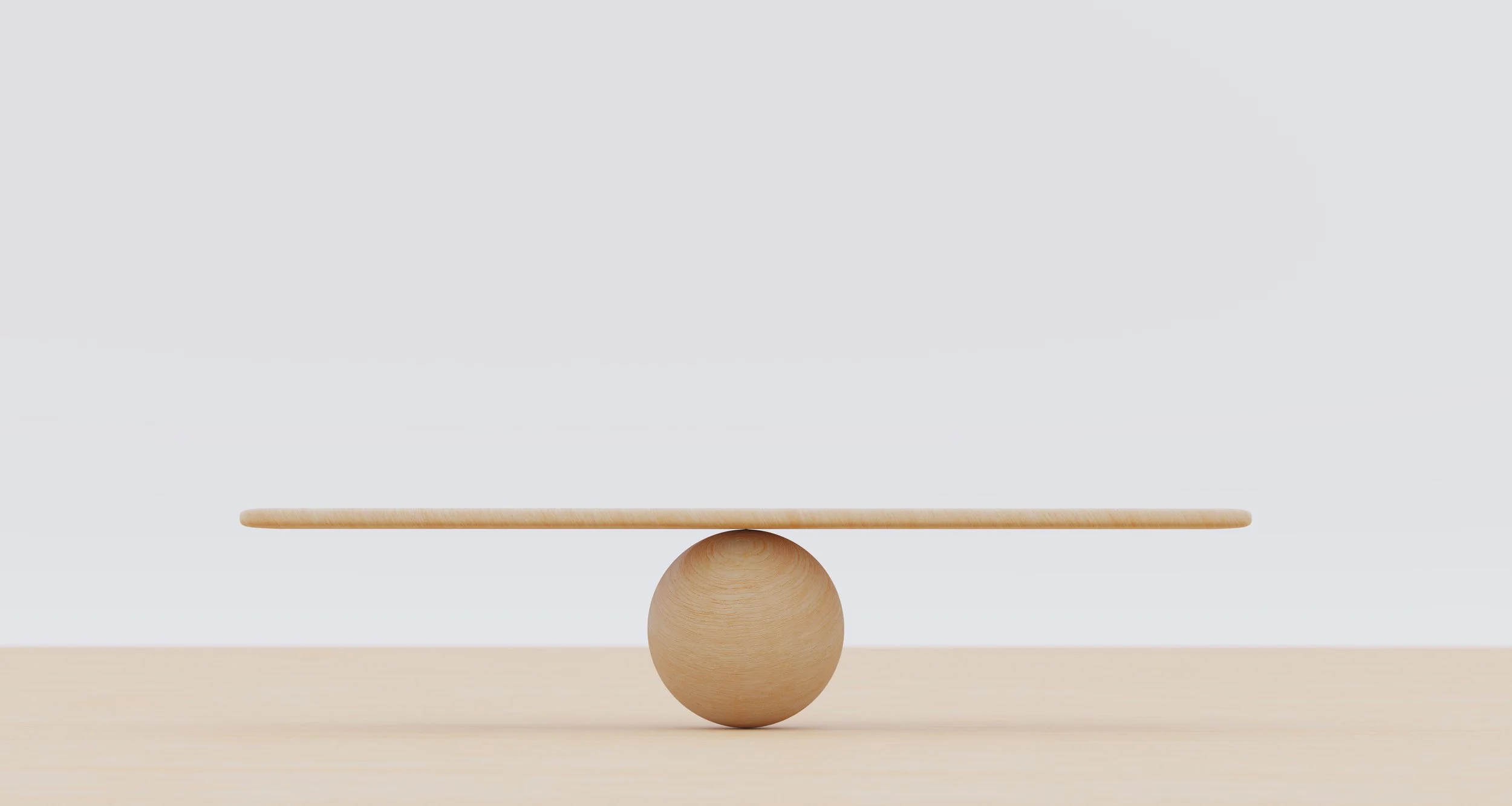 Wooden balance sculpture symbolizing stability and support.