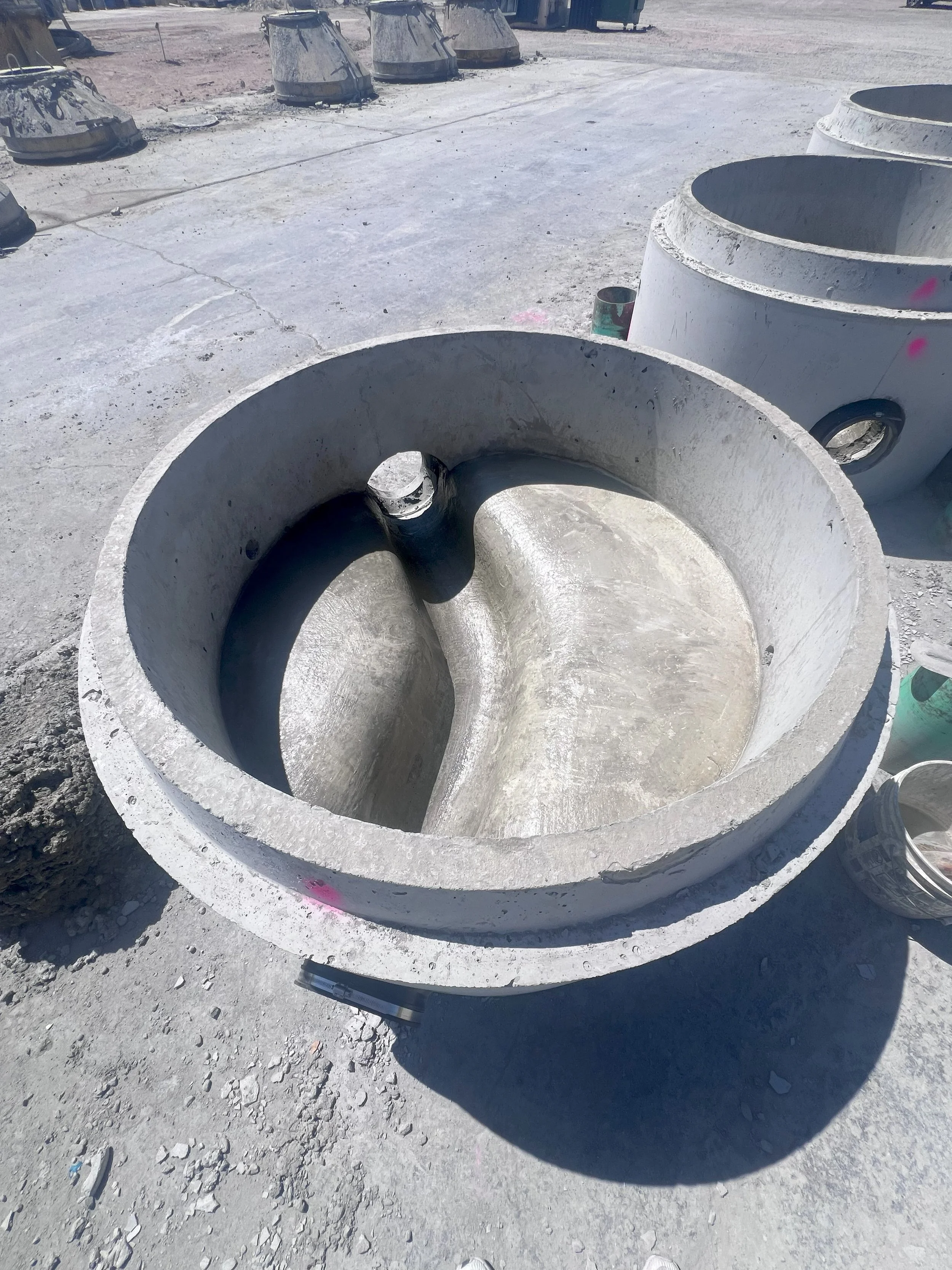 close up of sewer base with curve in yard.jpg