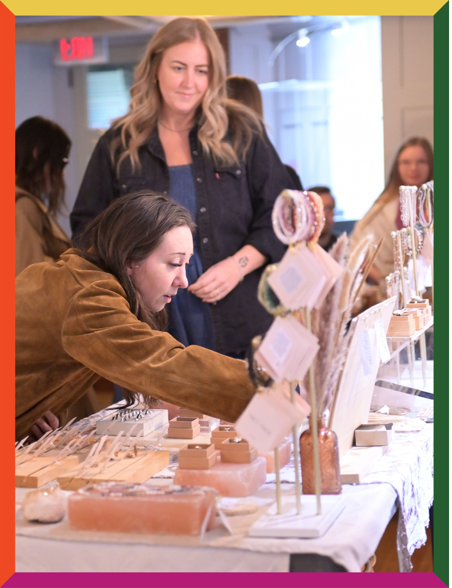Visitor shopping at harvest market at Lougheed House