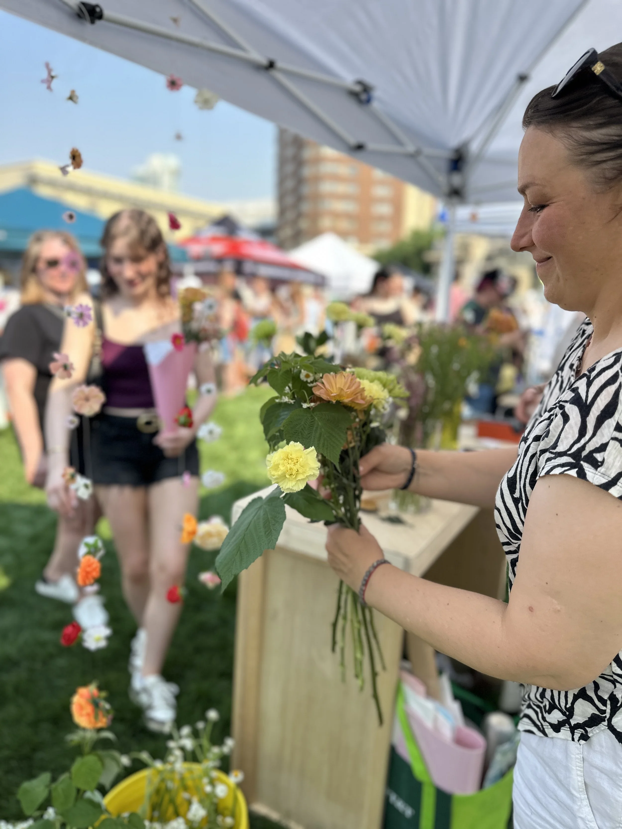 Florist booth making a bouquet for a customer