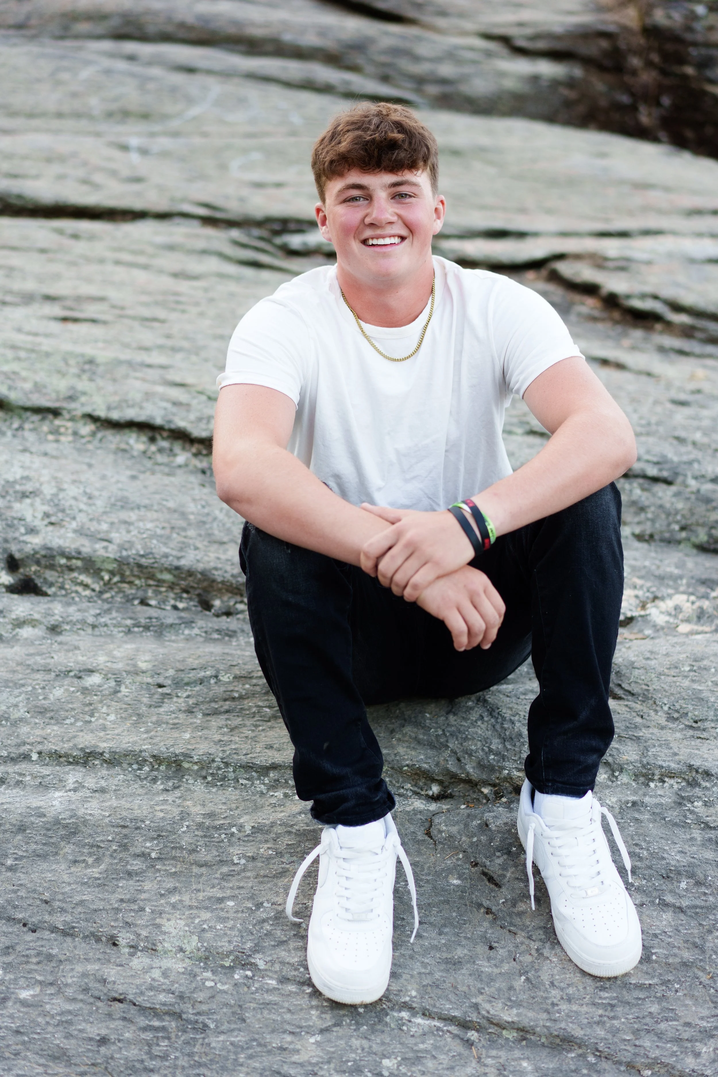 Spokane senior boy on the rocks ā Story Session