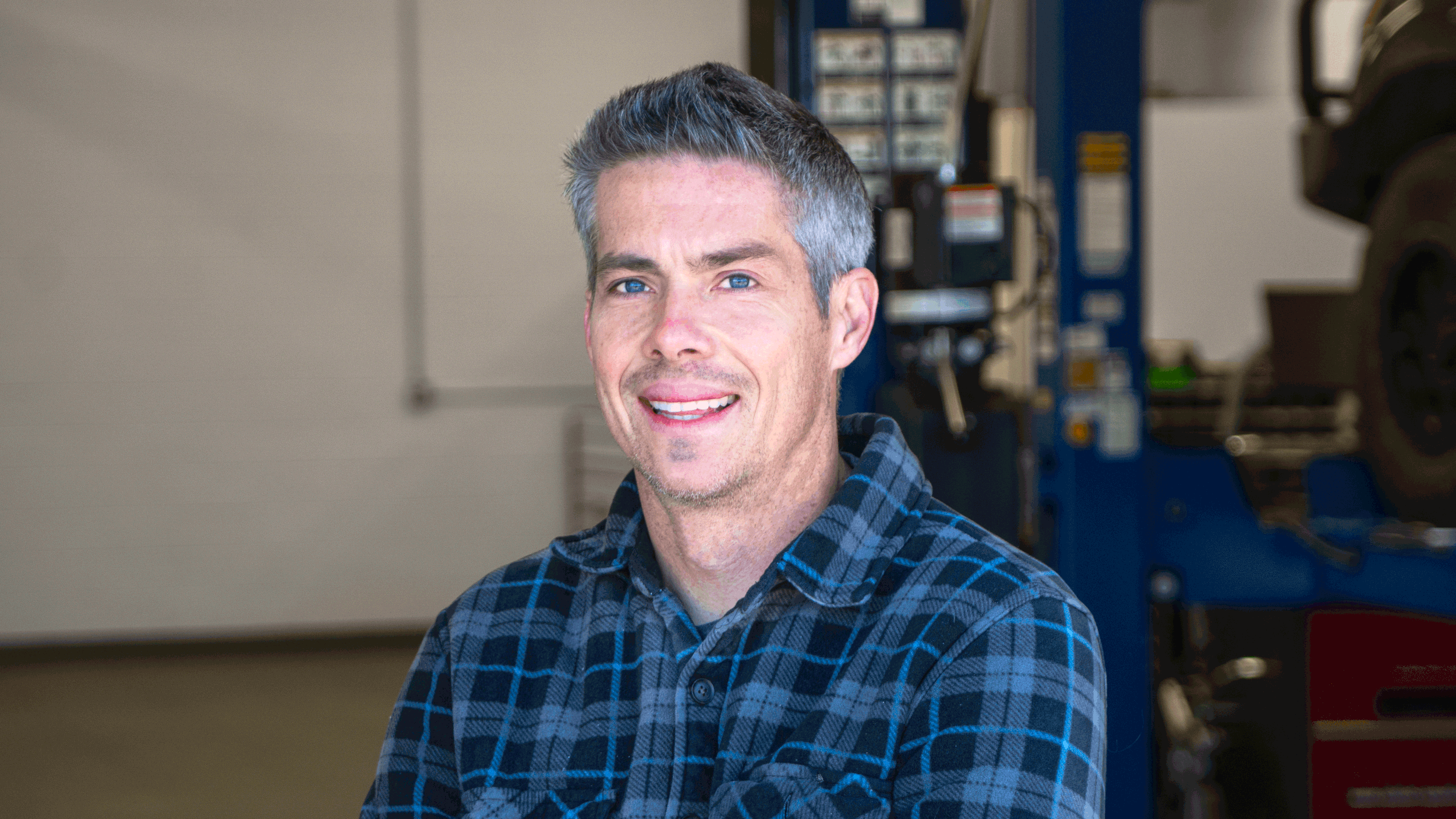 Owner of North Fork Automotive in Cascade, ID smiling to the camera