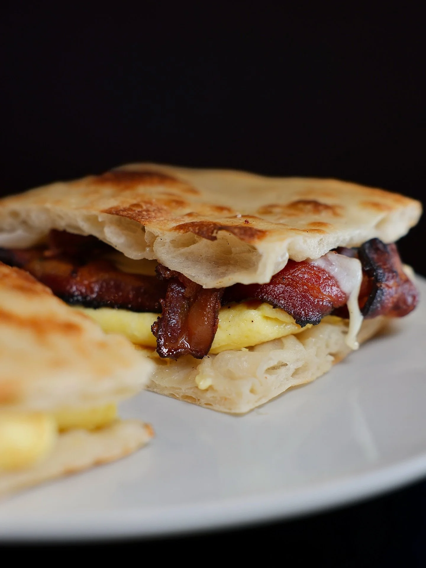Missed breakfast with us this weekend? Don&rsquo;t worry&mdash;you can catch us any day of the week. Our Bacon, Egg &amp; Cheese panini on fresh Panini Romana bread with two cracked eggs and crispy bacon is the kind of start worth waking up for. 🥓🍳