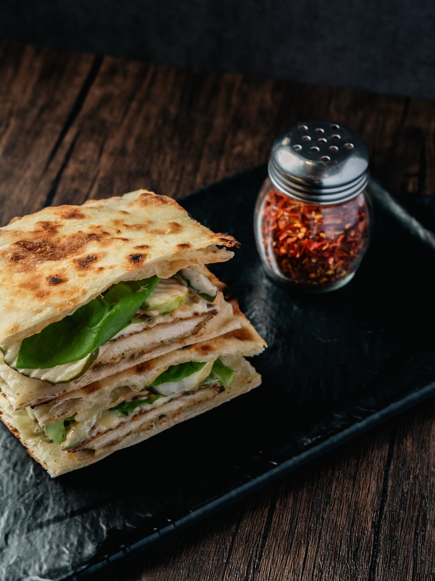 🥪 The American Panini

Crispy chicken cutlet layered with perfectly melted American cheese, crunchy pickles, fresh lettuce, and ripe tomato. Finished with our signature sauce and pressed to golden perfection &mdash; bold, comforting, and straight-up