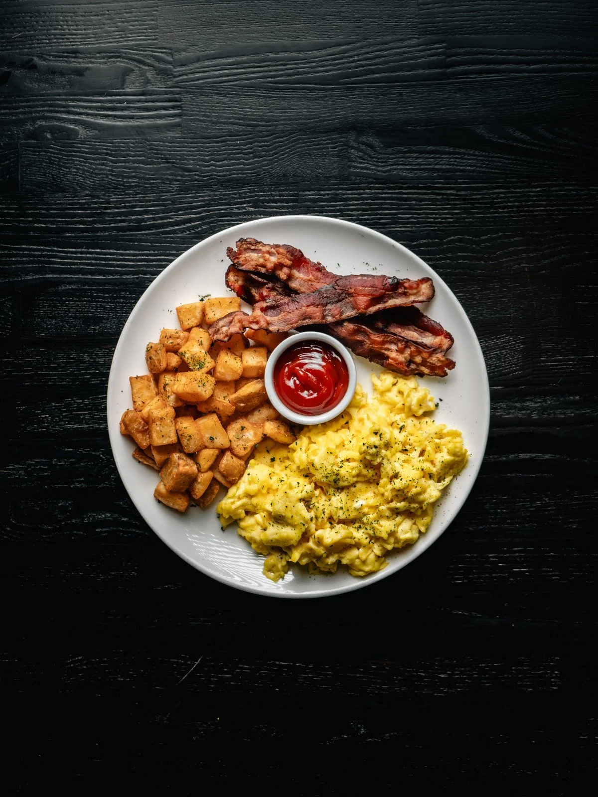 Florenza breakfast bowl with scrambled eggs, home fries and bacon