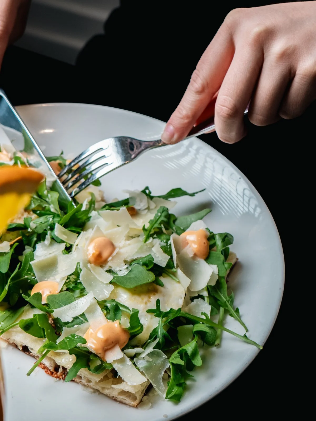 Florenza Toast with fried eggs, arugula and shaved cheese