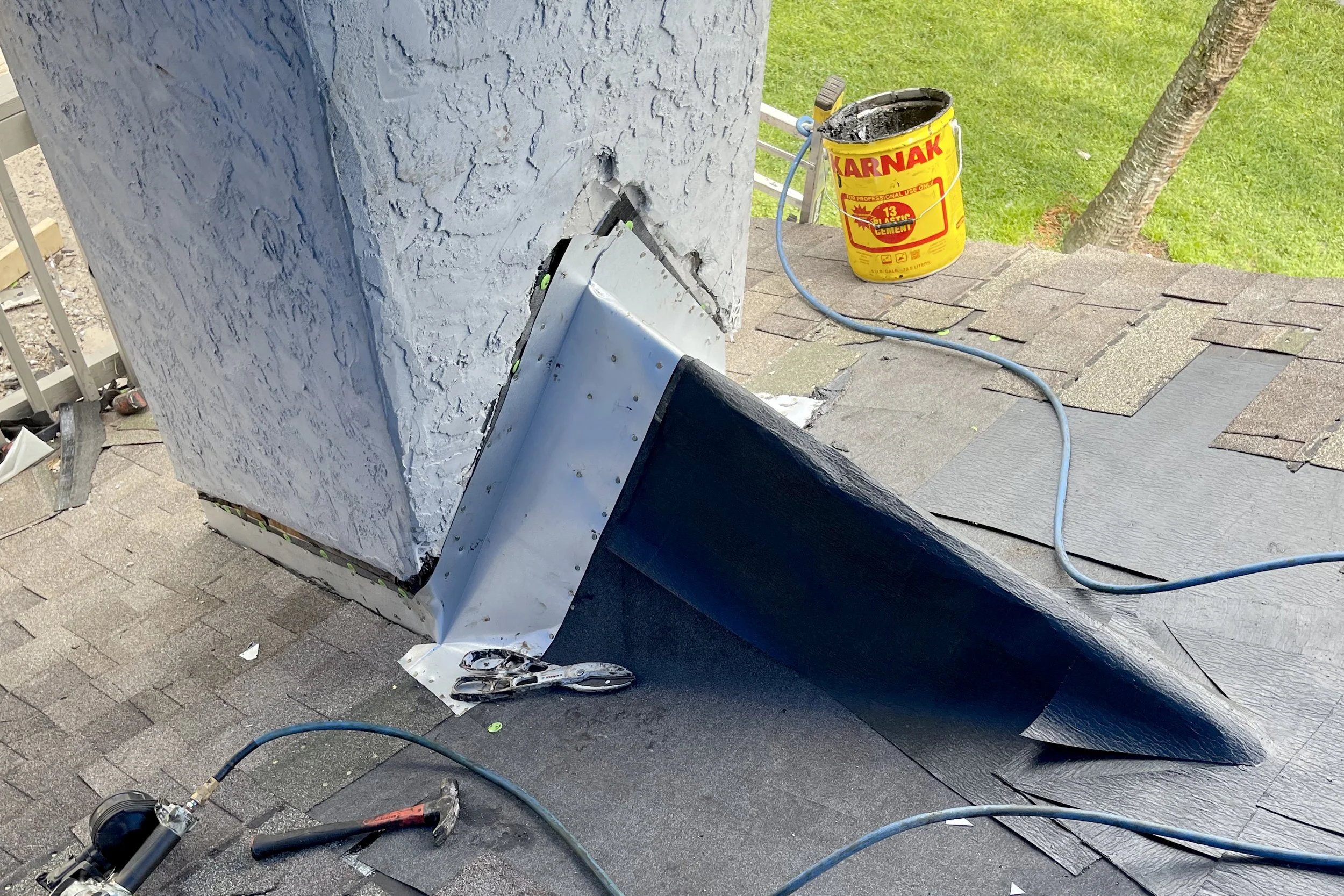 Chimney cricket installation to solve chimney leak issue in orlando florida