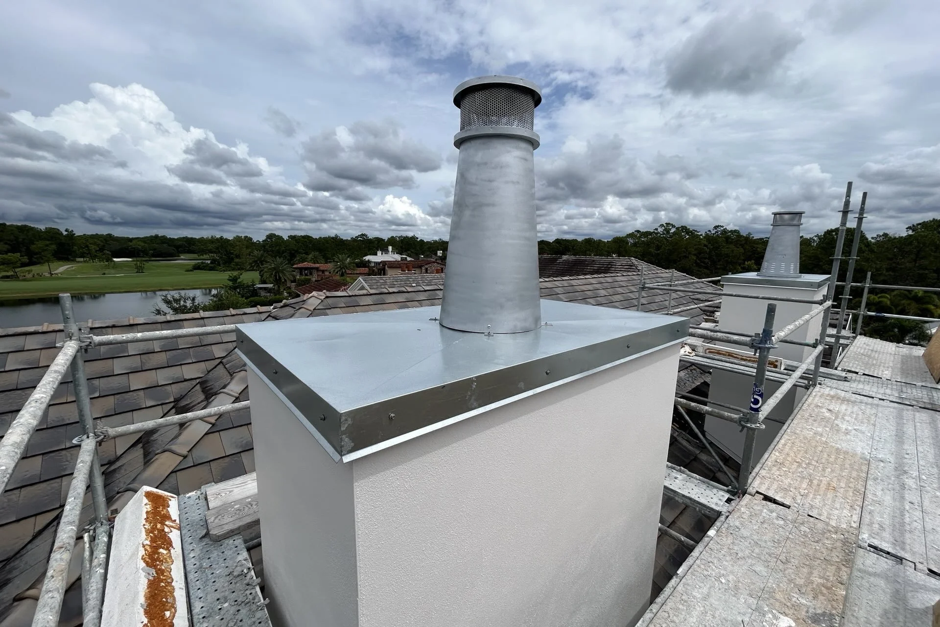 Full chimney refurbishment and rebuild in Windermere Florida. This picture shows a structural chimney repair, stucco installation and chimney installation in Golden Oaks FL