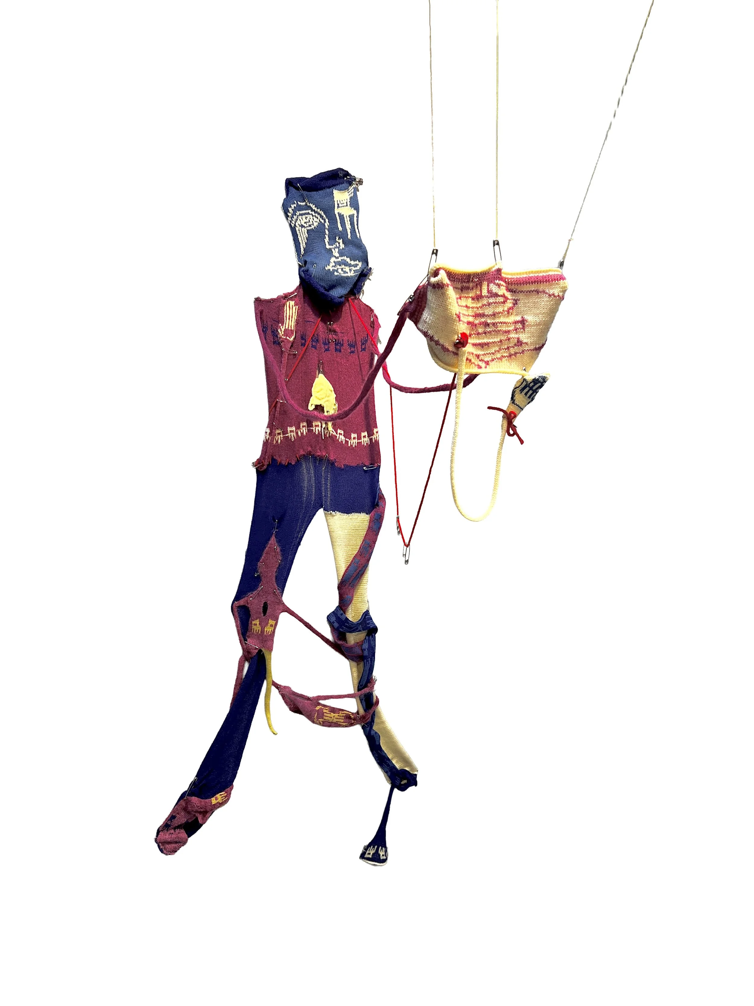 ND HG?, machine knit figure using experimental techniques & punch cards, saftey pins, red string, 2025 (view1)