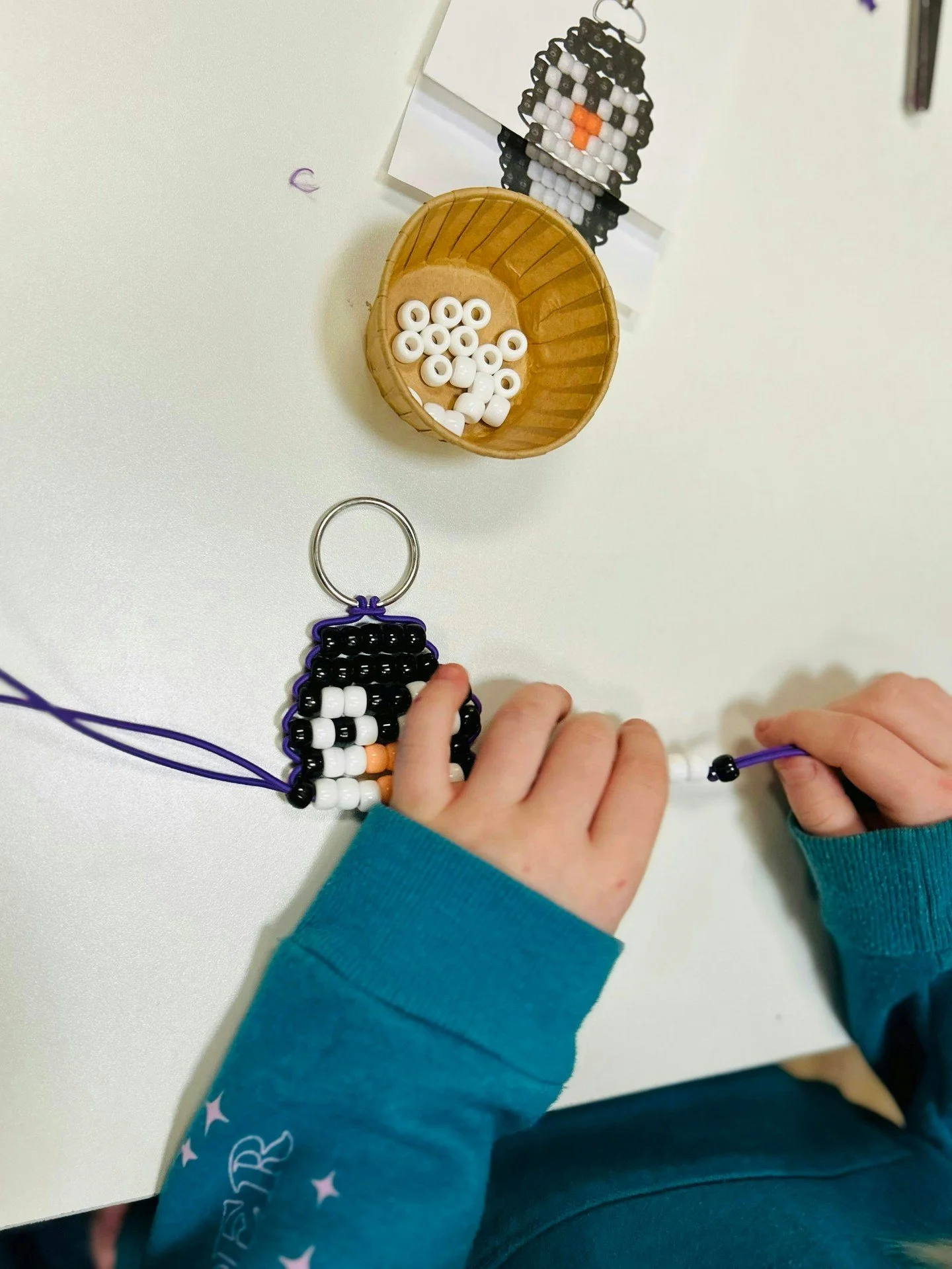 What the children see: a fun project involving beads, winter vibes, cute animals, and nostalgia. ❄️

What we see: An opportunity for small-motor skill development, finger dexterity, and hands-on learning!

At Soaring Learners, we combine learning AND