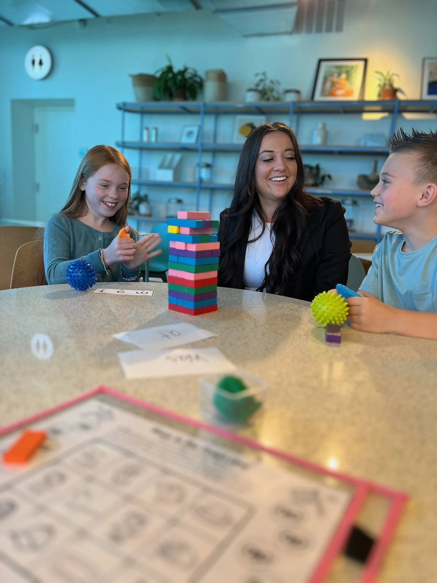 Founder of Soaring Learners, Robyn Bench, with a student laughing