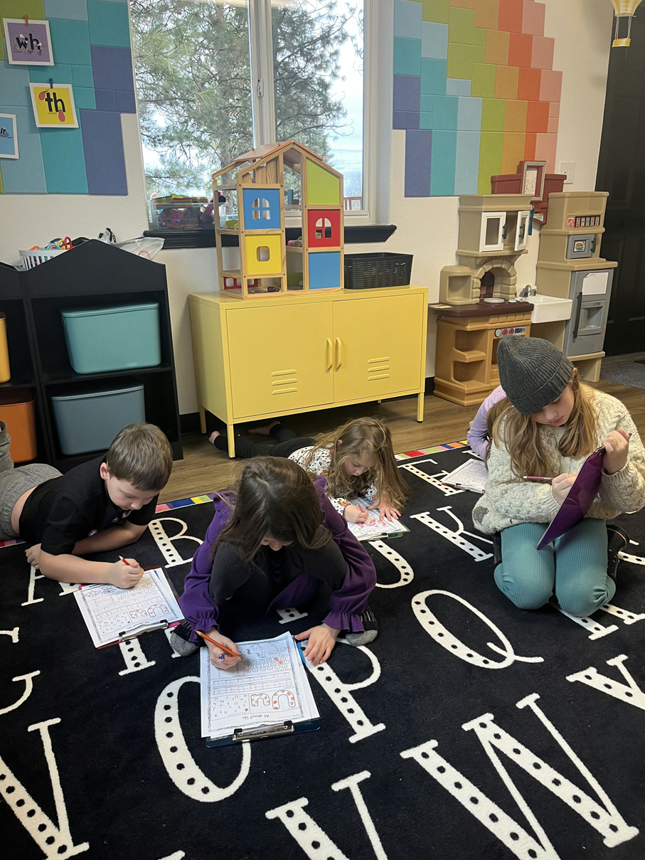 students at Soaring Learners doing work