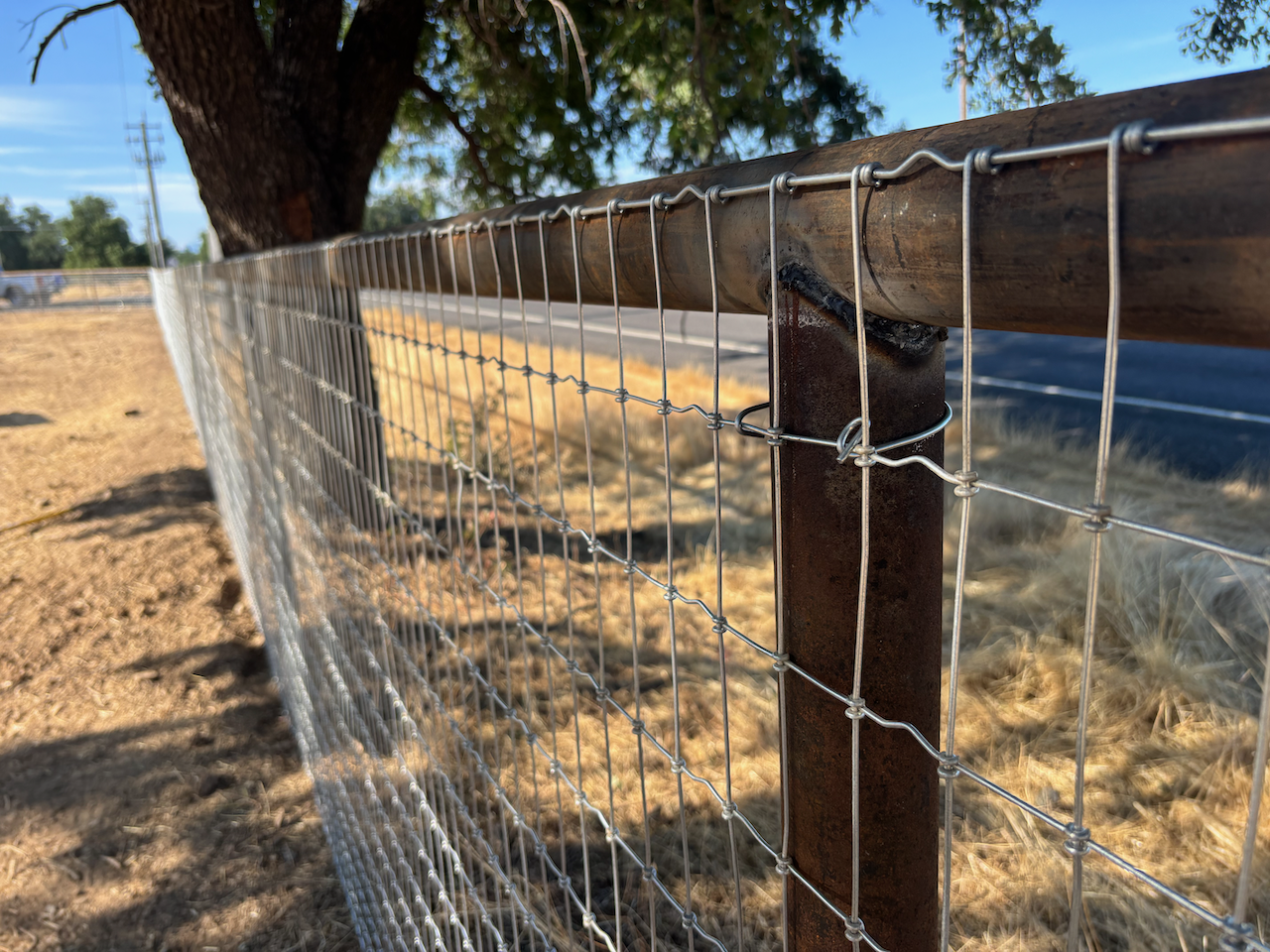 Pipe fence installed by Dozier Excavating.