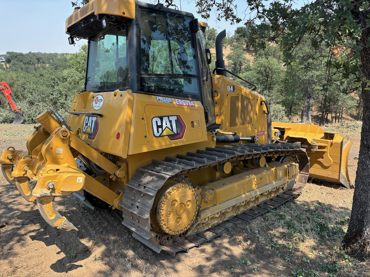 A yellow CAT bulldozer used in Dozier Excavating Project.