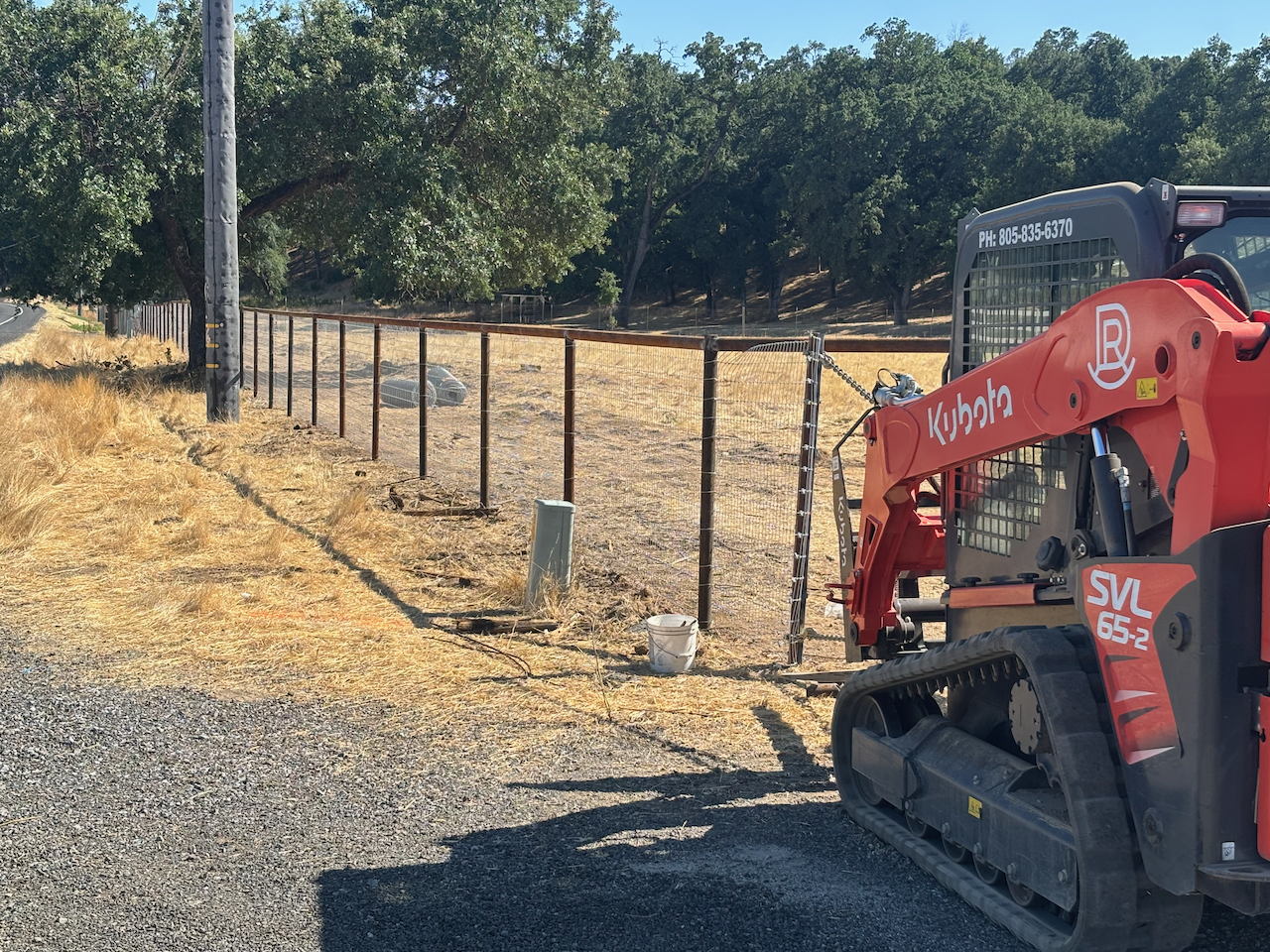 Kubota Skid Steer at pipe fence installation.