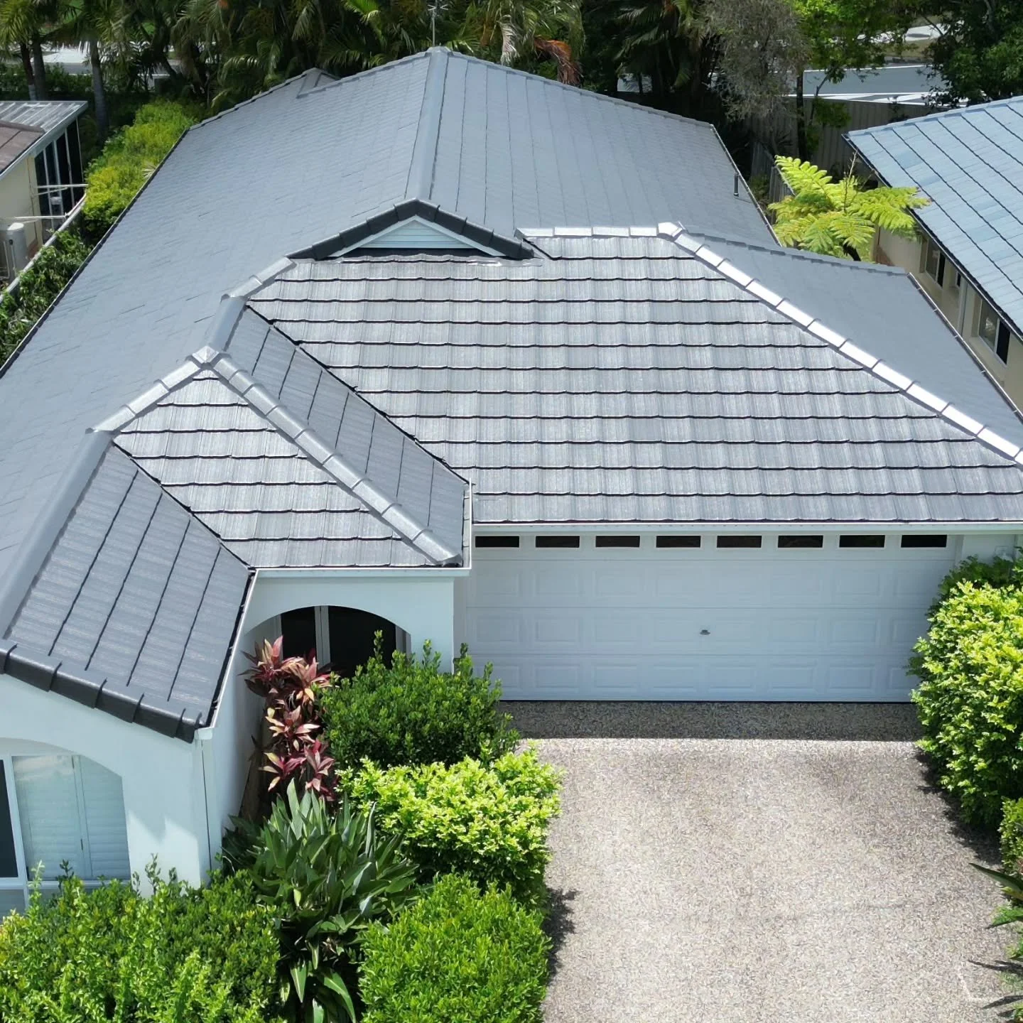 Another roof brought back to life with a fresh new look. We transformed this tired green roof to COLORBOND&reg; Monument, giving the home a clean, modern finish that completely refreshes the property.