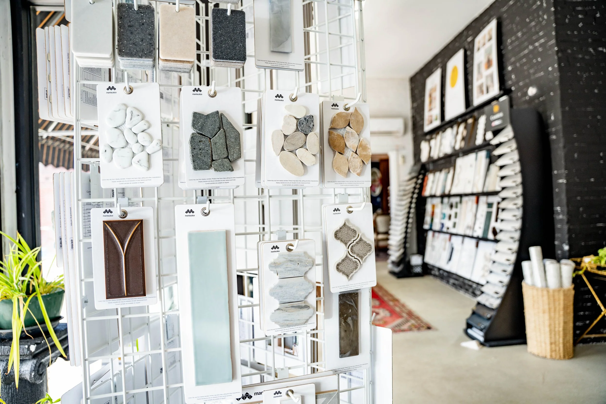 Display of various stone samples and tiles in a home improvement store.