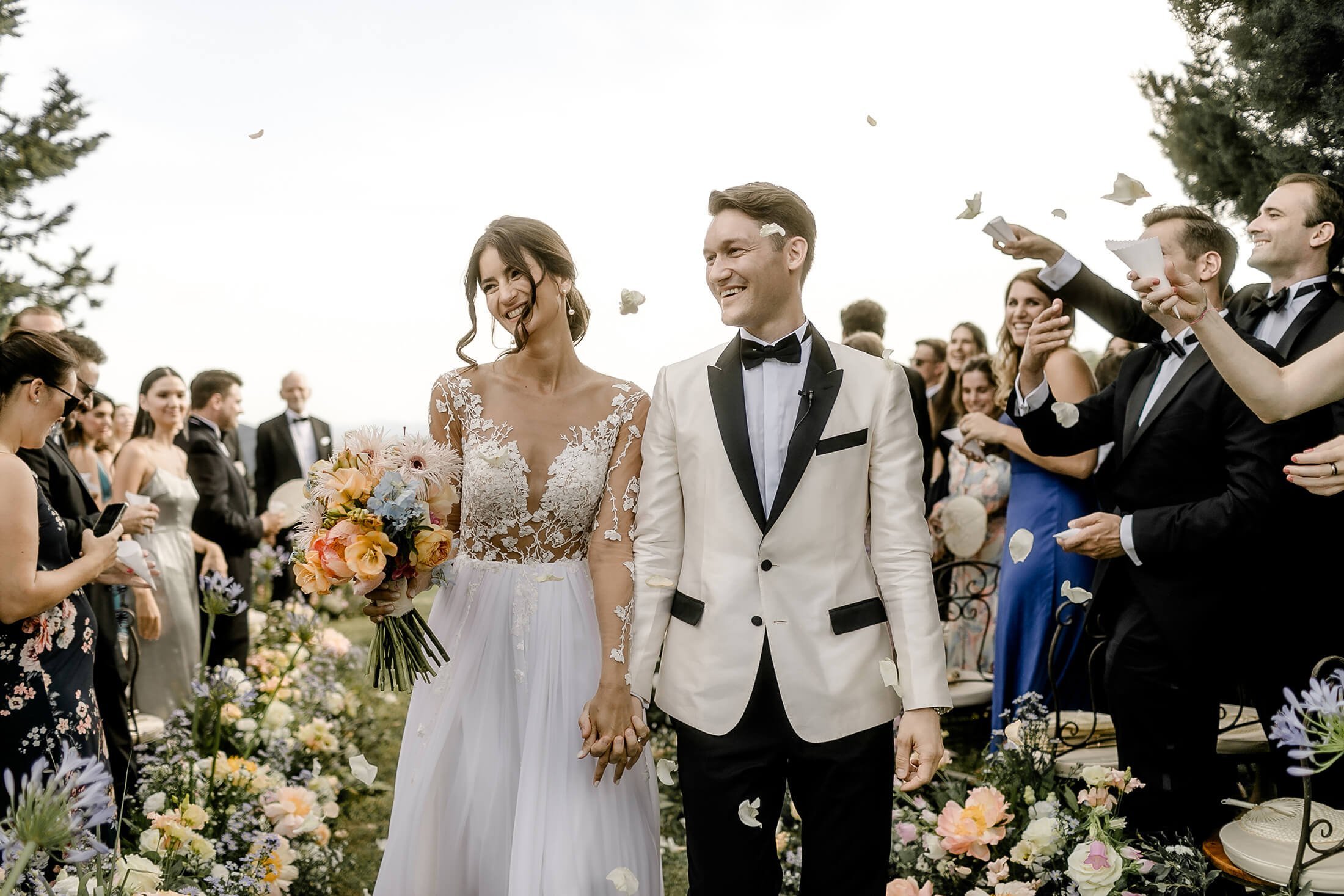 couple walking down the aisle at their destination wedding Italy