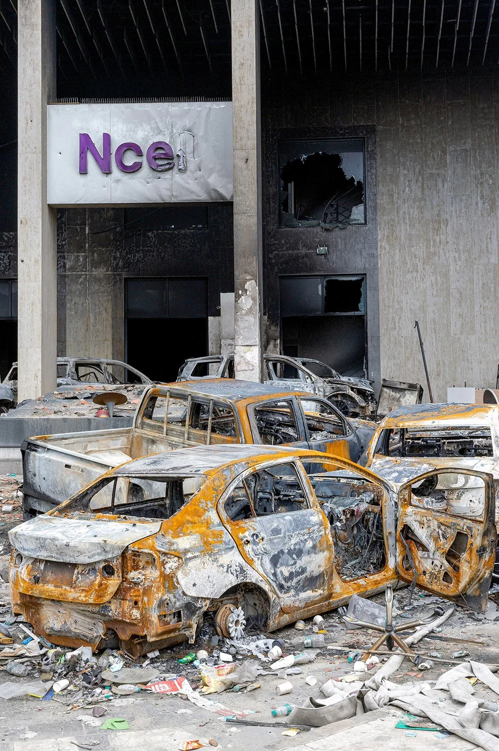 [Act III: Aftermath]. Courtyard of Ncell Tower full of burnt cars.