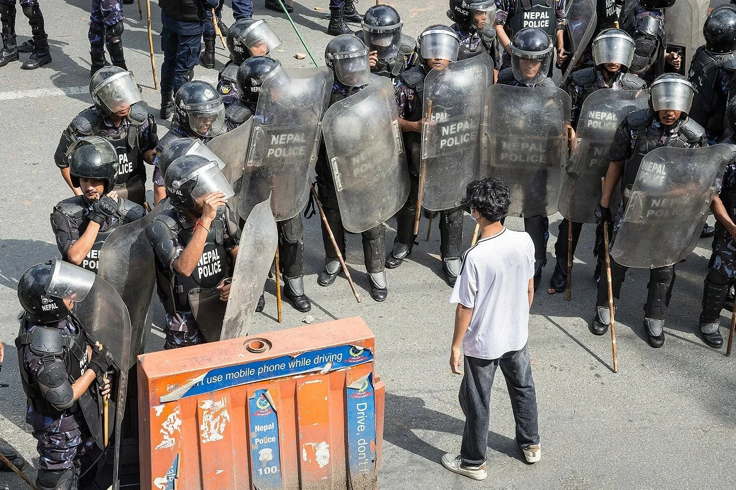 Protester challenging police during kathmandu Protests.