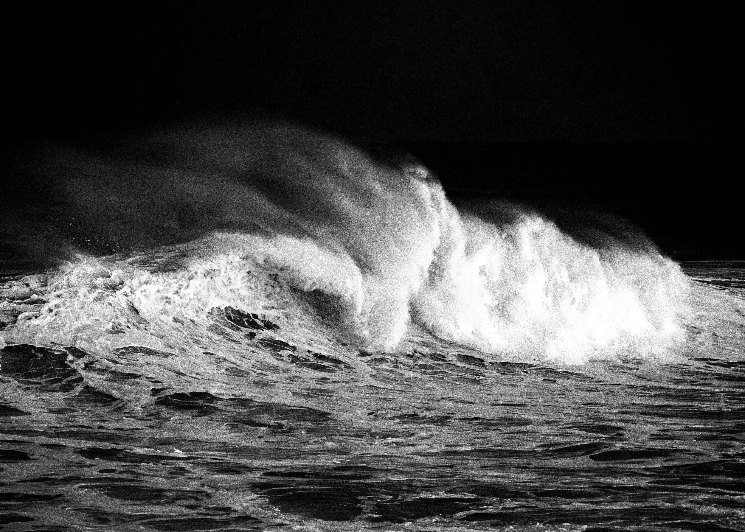 Towering waves surge with devastating force as Cyclone Alfred unleashes its full power along the coastline.