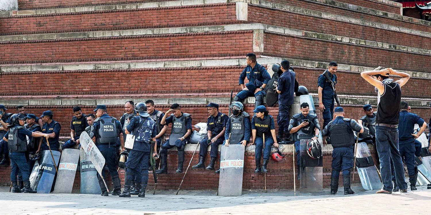 [Act II: Collision]. Army units march through Durbar Square.